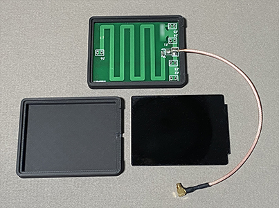 A small pc board antenna, shown with enclosure halves.