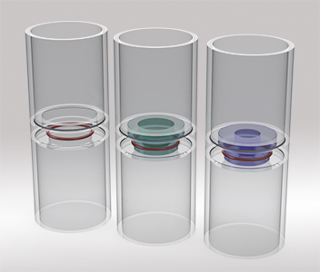 A series of three polycarbonate cylindrical lab vessels.